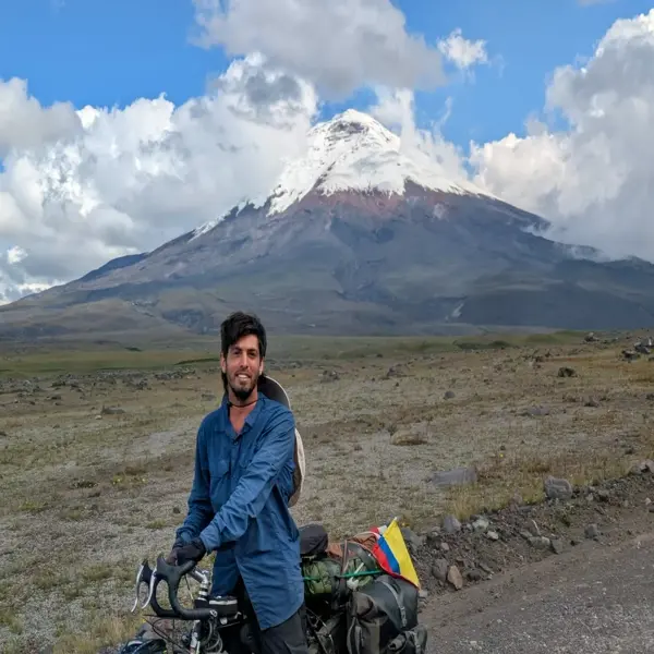 Tourman with his bike near Chimborazo mountain